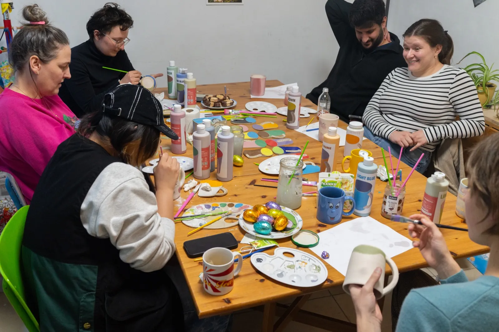 Shaping clay on pottery wheel